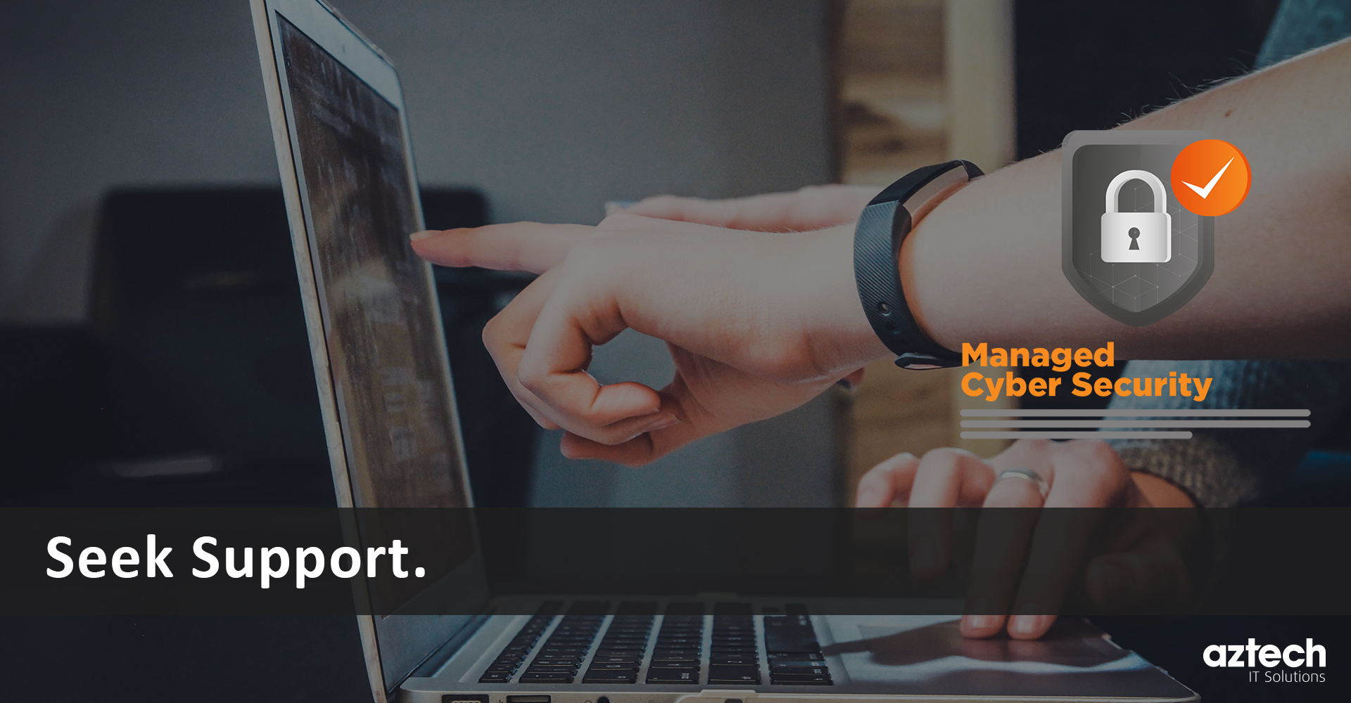 Image of people pointing at a laptop