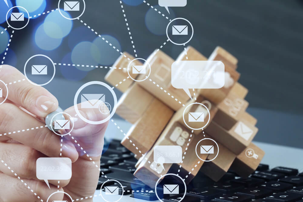 close-up-of-businessman-hand-use-interactive-computer-with-virtual-email-icon-as-concept